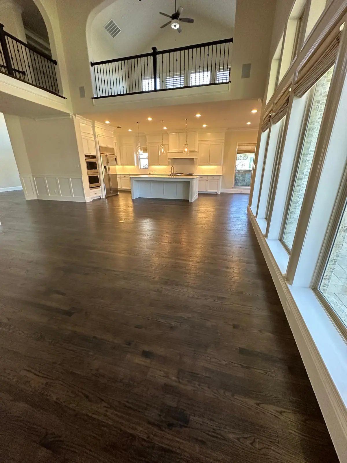 Luxury hardwood flooring installation in North Texas showcasing wide-plank natural wood floors with a modern, elegant finish for residential interiors