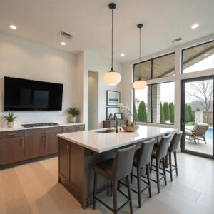 Contemporary North Dallas kitchen remodel featuring sleek cabinets, quartz countertops, pendant lighting, and open layout overlooking the backyard showcasing modern home renovation design trends & home remodel costs in North Dallas, TX.